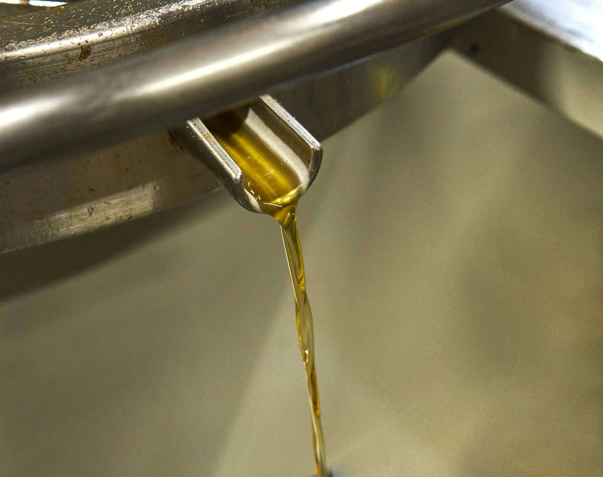 Clean motor oil pouring into an engine