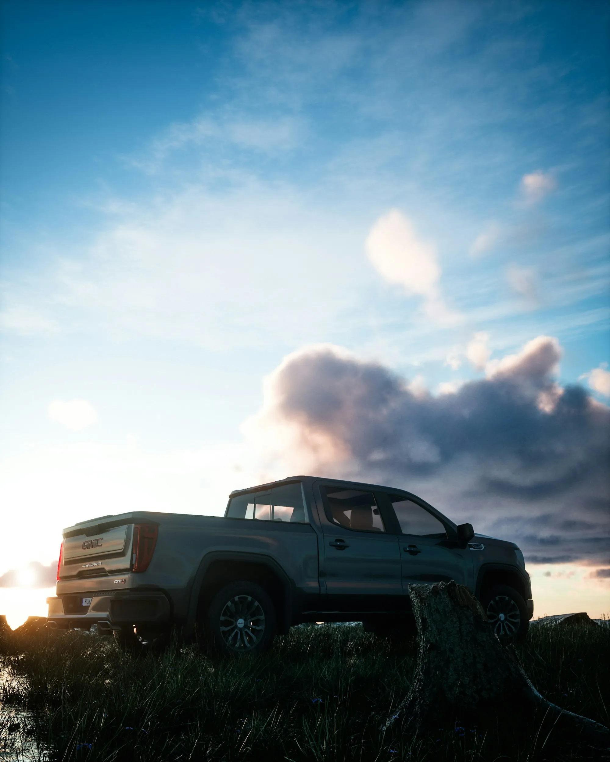 Dark pickup truck under a dramatic sky